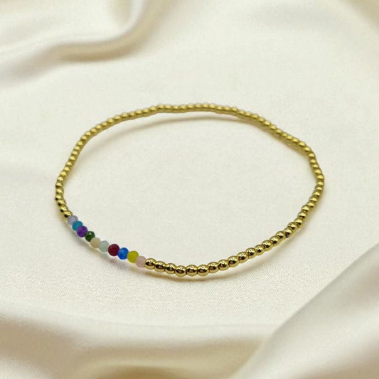 Armband aus goldenen Hämatitkugeln und bunten facettierten Zirkonia